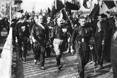 From left to right: unknown, Benito Mussolini, Cesare Maria de Vecchi and Michele Bianchi in 1922